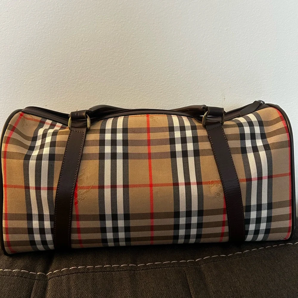 Burberrys Haymarket Boston Tan Duffel with Brown Leather Trim 10H x 19W inches
